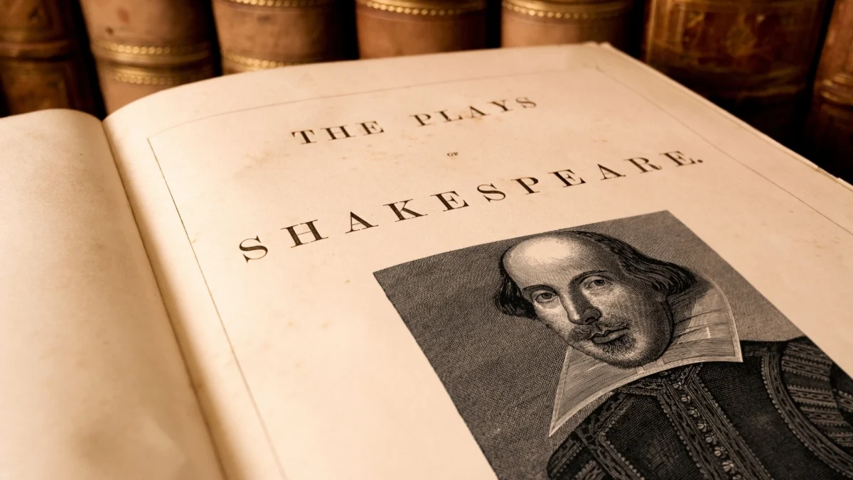 Vintage edition of "The Plays of Shakespeare" featuring a classic portrait of William Shakespeare and antique books in the background.